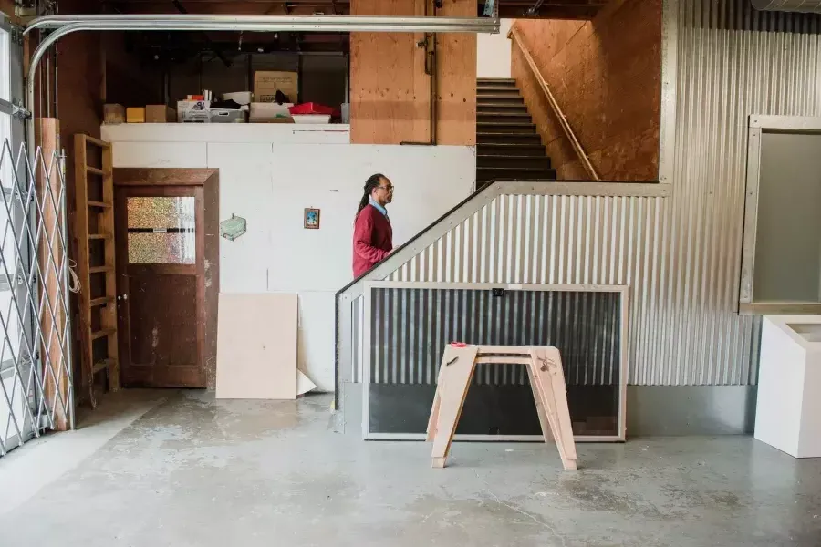 Ron Moultrie Saunders walking up studio stairs.