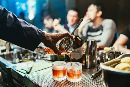 Bartender pouring cocktails