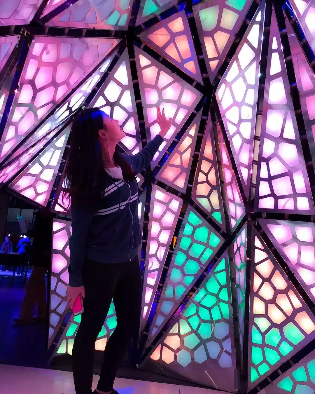 Woman interacting with exhibit at Exploratorium 